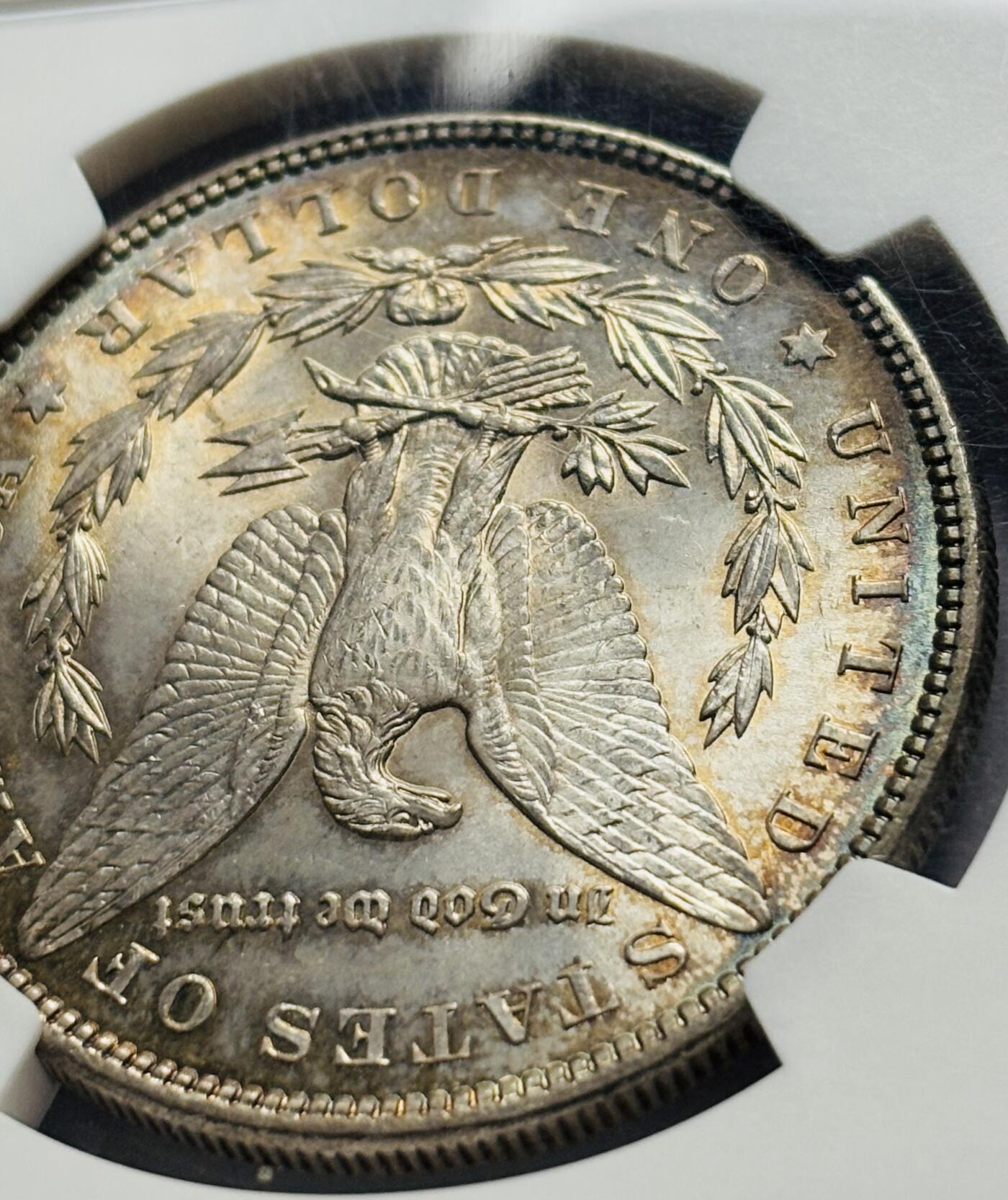 文馨钱币收藏第 283 场，【大雪鉴珍，寒英缀金】金银纪念币精品场，诚邀您的参与【长期接代拍品】 1885 年美国摩根一元银元 NGC 评级 MS64 分，高光五彩，彩虹酱金黄包浆，一眼尽收眼底