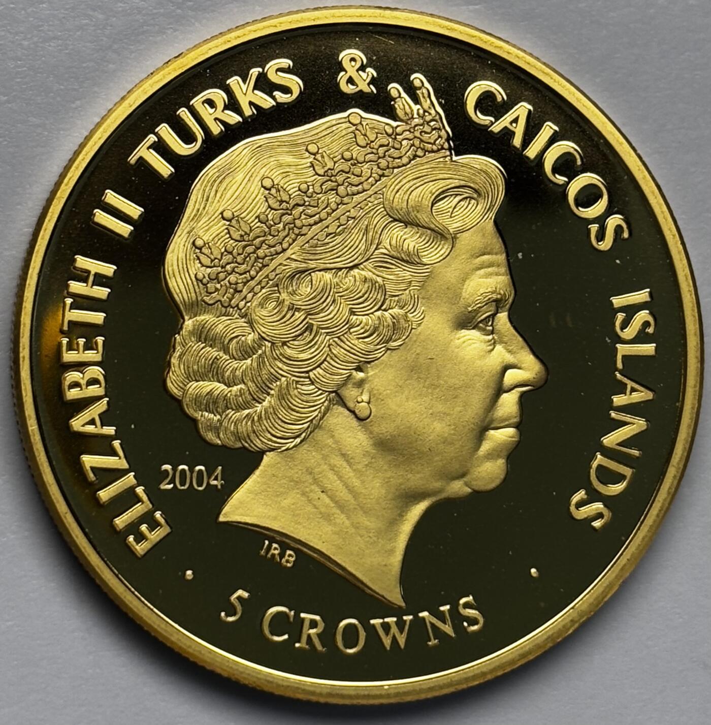 文馨钱币收藏第 283 场，【大雪鉴珍，寒英缀金】金银纪念币精品场，诚邀您的参与【长期接代拍品】 全新 2004 年特克斯和凯克斯群岛 5 克朗精制镀金纪念币