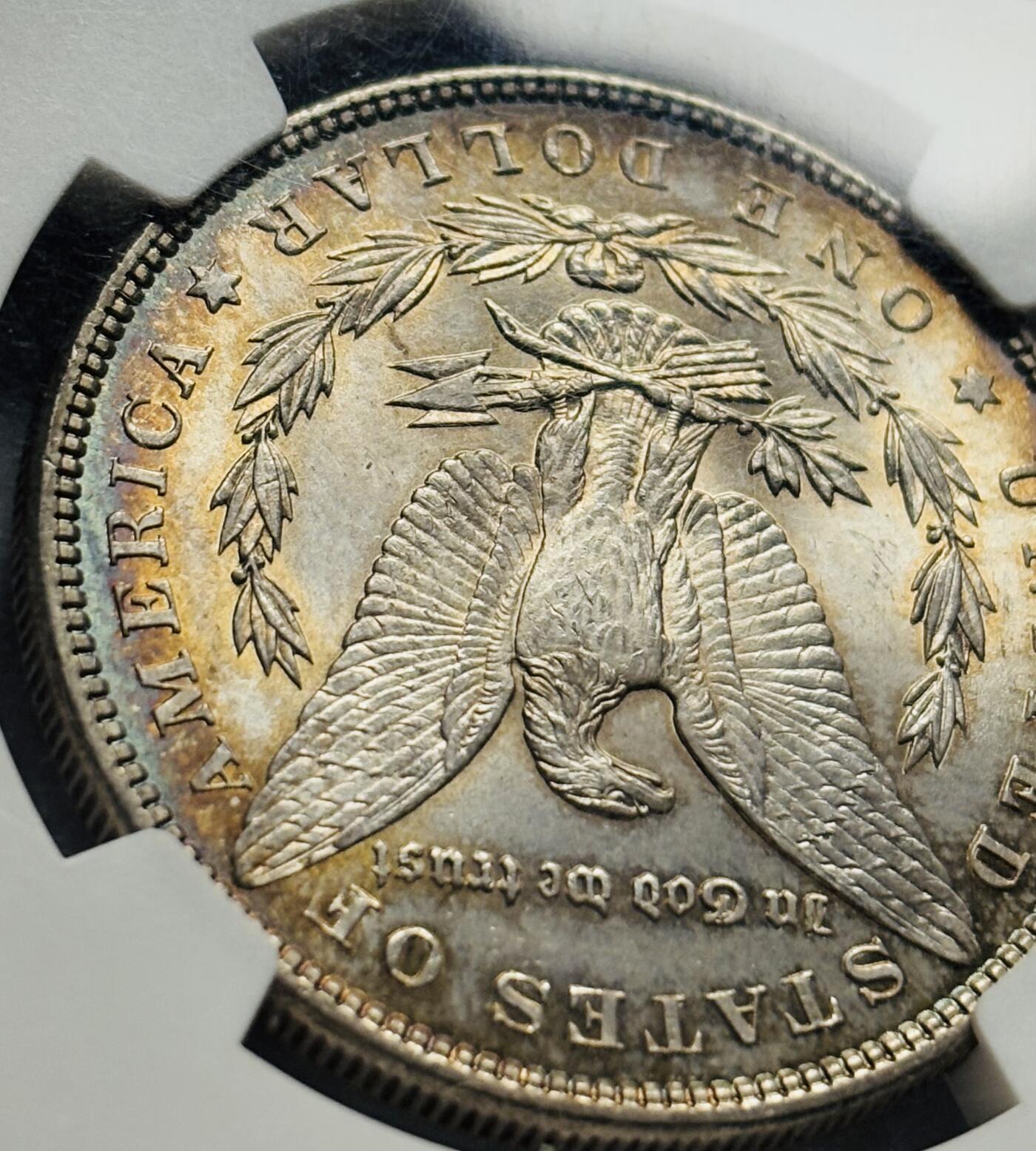 文馨钱币收藏第 283 场，【大雪鉴珍，寒英缀金】金银纪念币精品场，诚邀您的参与【长期接代拍品】 1885 年美国摩根一元银元 NGC 评级 MS64 分，高光五彩，彩虹酱金黄包浆，一眼尽收眼底