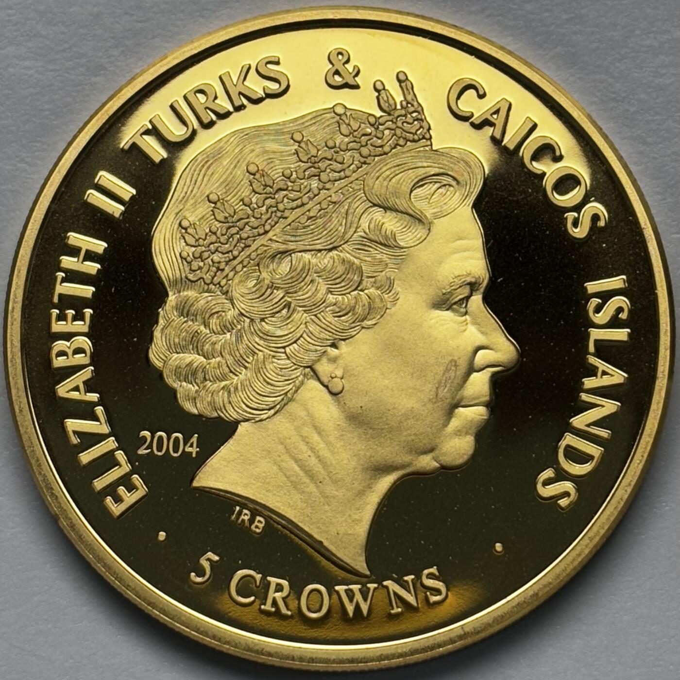 文馨钱币收藏第 283 场，【大雪鉴珍，寒英缀金】金银纪念币精品场，诚邀您的参与【长期接代拍品】 全新 2004 年特克斯和凯克斯群岛 5 克朗精制镀金纪念币