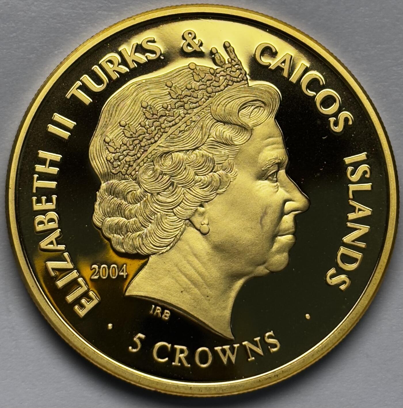 文馨钱币收藏第 283 场，【大雪鉴珍，寒英缀金】金银纪念币精品场，诚邀您的参与【长期接代拍品】 全新 2004 年特克斯和凯克斯群岛 5 克朗精制镀金纪念币