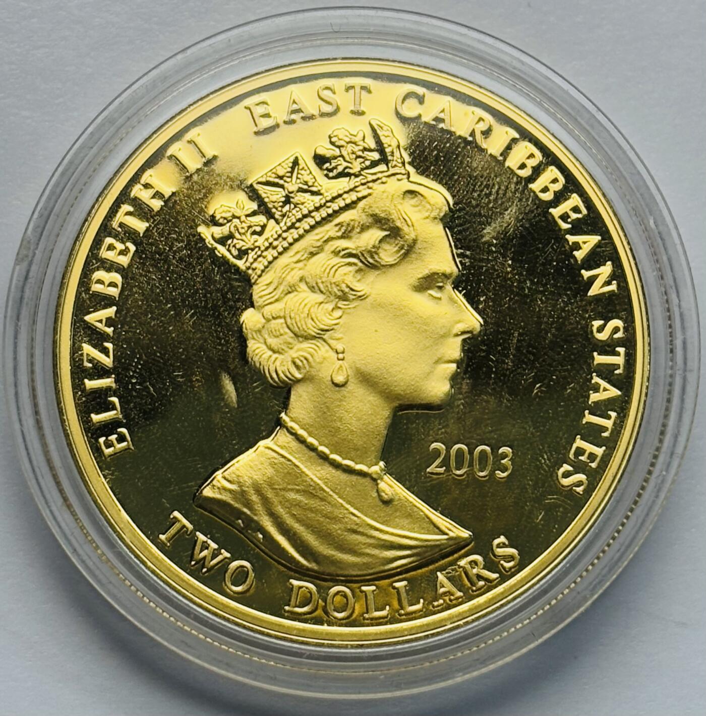 文馨钱币收藏第 283 场，【大雪鉴珍，寒英缀金】金银纪念币精品场，诚邀您的参与【长期接代拍品】 全新 2003 年东加勒比 1157-1199 查理一世 2 元精制镀金纪念币