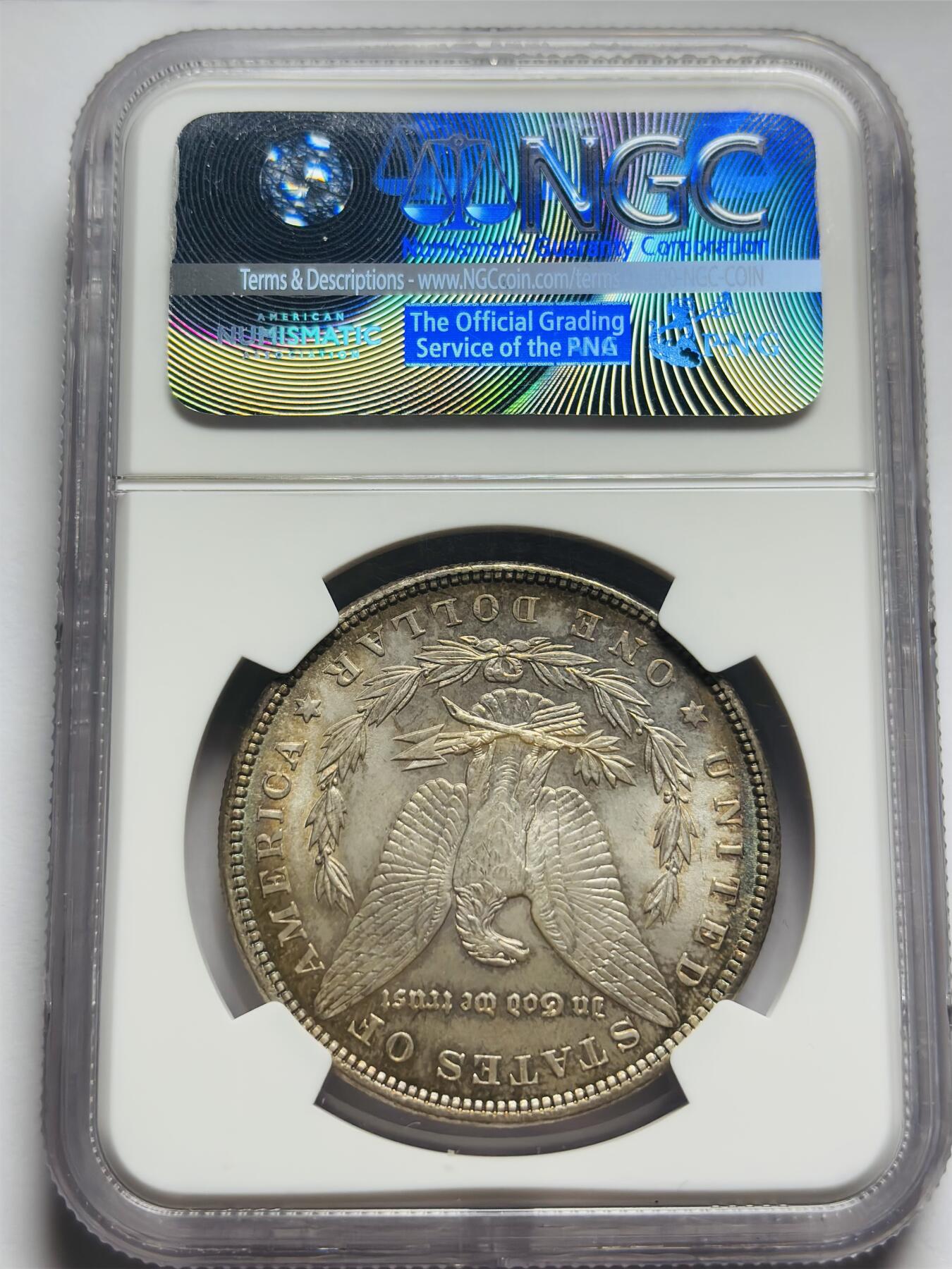 文馨钱币收藏第 283 场，【大雪鉴珍，寒英缀金】金银纪念币精品场，诚邀您的参与【长期接代拍品】 1885 年美国摩根一元银元 NGC 评级 MS64 分，高光五彩，彩虹酱金黄包浆，一眼尽收眼底