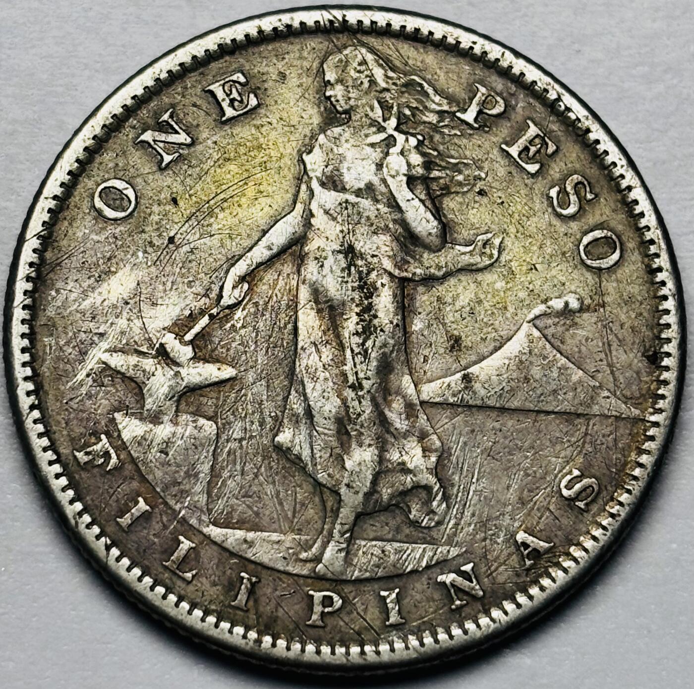 文馨钱币收藏第 283 场，【大雪鉴珍，寒英缀金】金银纪念币精品场，诚邀您的参与【长期接代拍品】 少见 1907 年美属菲律宾管辖时期 打铁女神 1 比索大银币，20 克 800 高银，第二版首发年