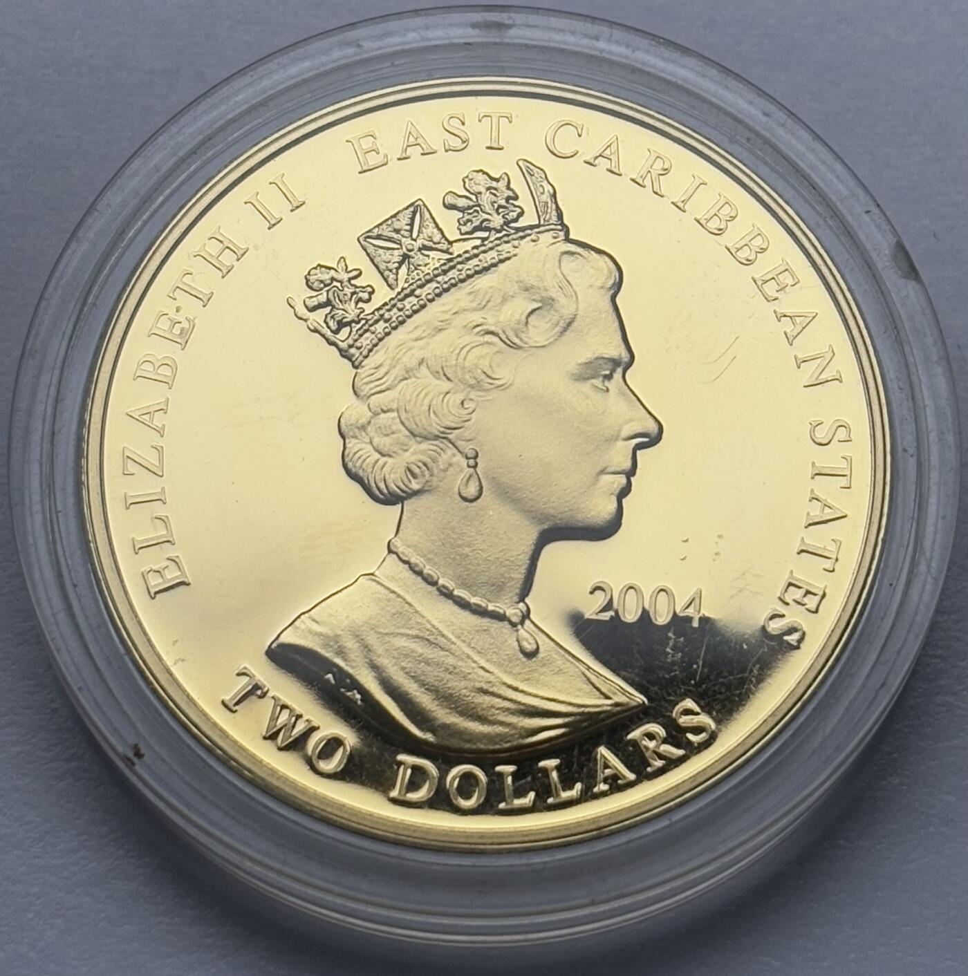 文馨钱币收藏第 283 场，【大雪鉴珍，寒英缀金】金银纪念币精品场，诚邀您的参与【长期接代拍品】 全新 2004 年东加勒比 1133-1189 亨利二世铜镍镀金 2 元精制纪念币