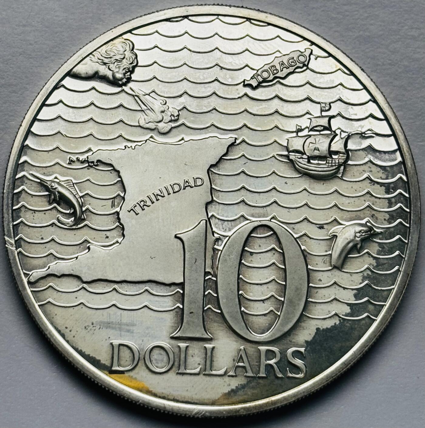 文馨钱币收藏第 283 场，【大雪鉴珍，寒英缀金】金银纪念币精品场，诚邀您的参与【长期接代拍品】 少见全新 1973 年特立尼达和多巴哥 10 元精制纪念大银币，首发版只发行三年 35 克 925 高银