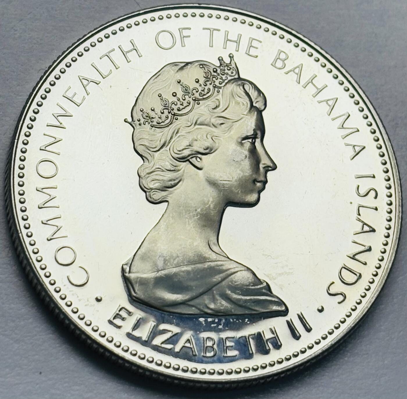 文馨钱币收藏第 283 场，【大雪鉴珍，寒英缀金】金银纪念币精品场，诚邀您的参与【长期接代拍品】 原光品相 1973 年巴哈马一元精制银币，第二版关门版只发行三年，18.14 克 800 高银