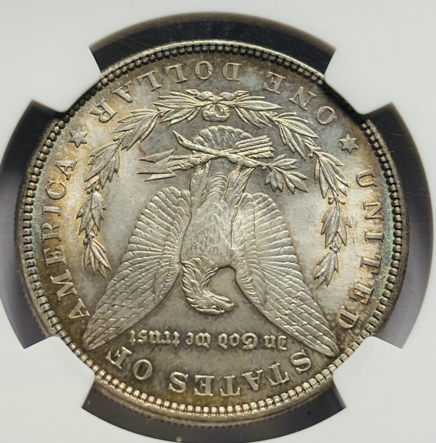 文馨钱币收藏第 283 场，【大雪鉴珍，寒英缀金】金银纪念币精品场，诚邀您的参与【长期接代拍品】 1885 年美国摩根一元银元 NGC 评级 MS64 分，高光五彩，彩虹酱金黄包浆，一眼尽收眼底