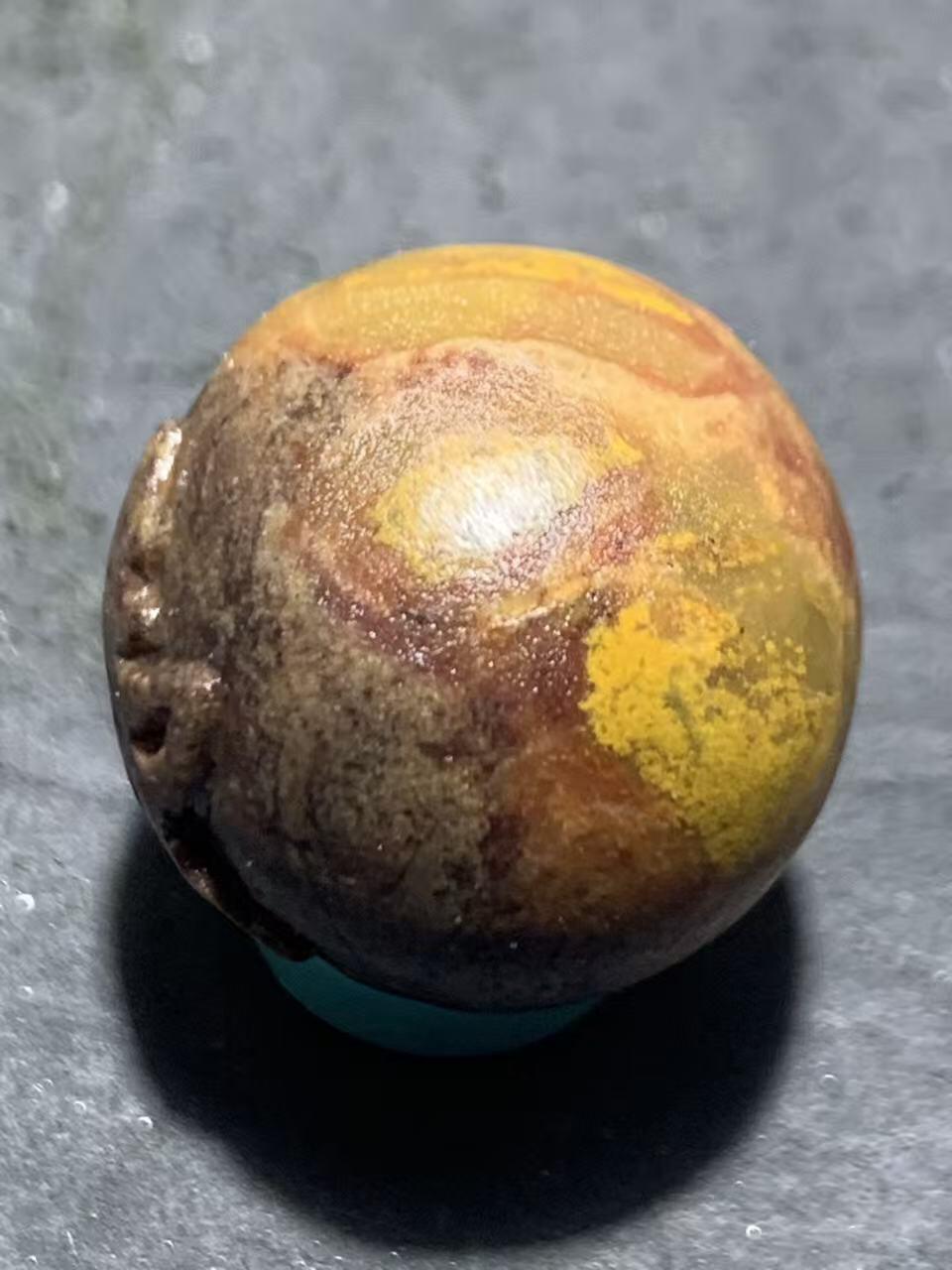 亚光战国红玛瑙手工雕刻佛字随形圆珠一颗