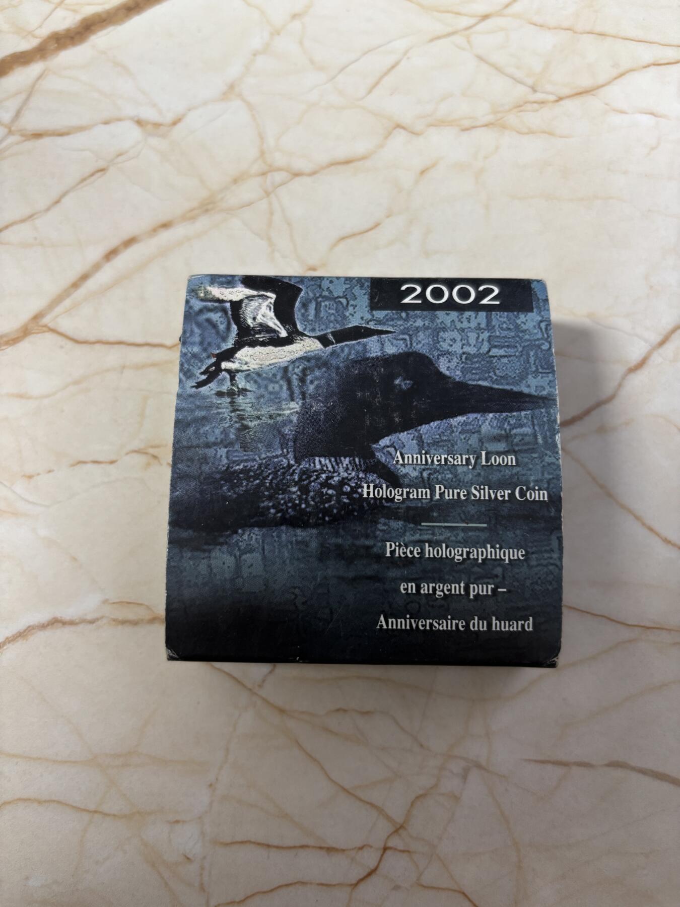 第184期拍卖 加拿大2002年潜鸟全息彩色1盎司纪念银币，9999银银价431，发行30000枚，有氧化