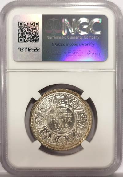 博洋堂世界钱币拍卖第150期（全场包邮） NGC MS63 英属印度1918年乔治五世1卢比银币 正面黄油光向橘黄色渐变，背面浅包浆银霜漂亮。达到63分的卢比就已经迈入大众好品相的标准了，划痕对于62分会少很多，加之来自库存品相完全未流通的出厂品相，光度会特别好。