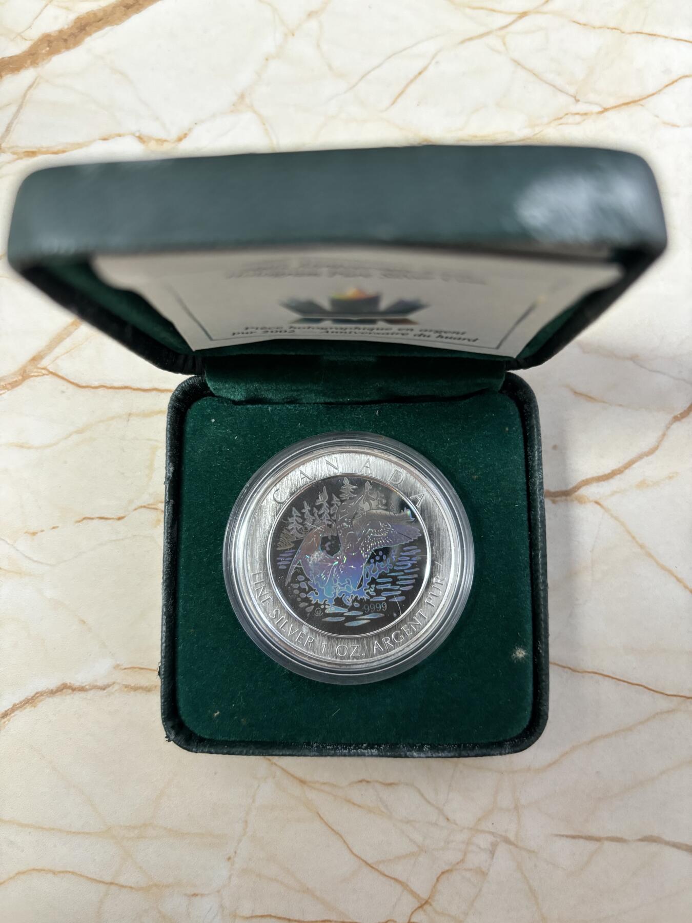 第184期拍卖 加拿大2002年潜鸟全息彩色1盎司纪念银币，9999银银价431，发行30000枚，有氧化