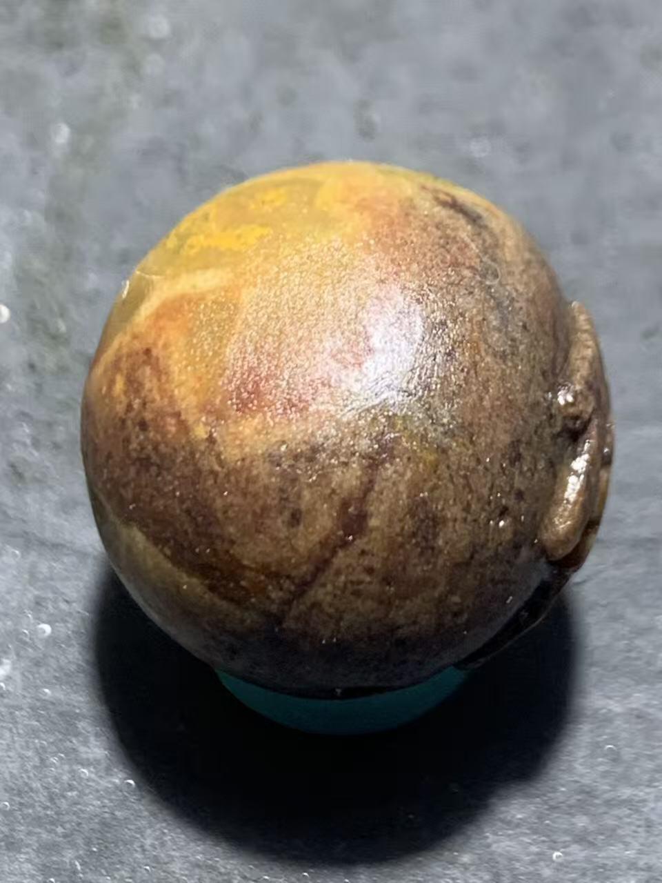 亚光战国红玛瑙手工雕刻佛字随形圆珠一颗