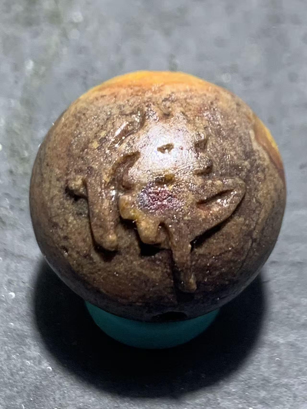 亚光战国红玛瑙手工雕刻佛字随形圆珠一颗