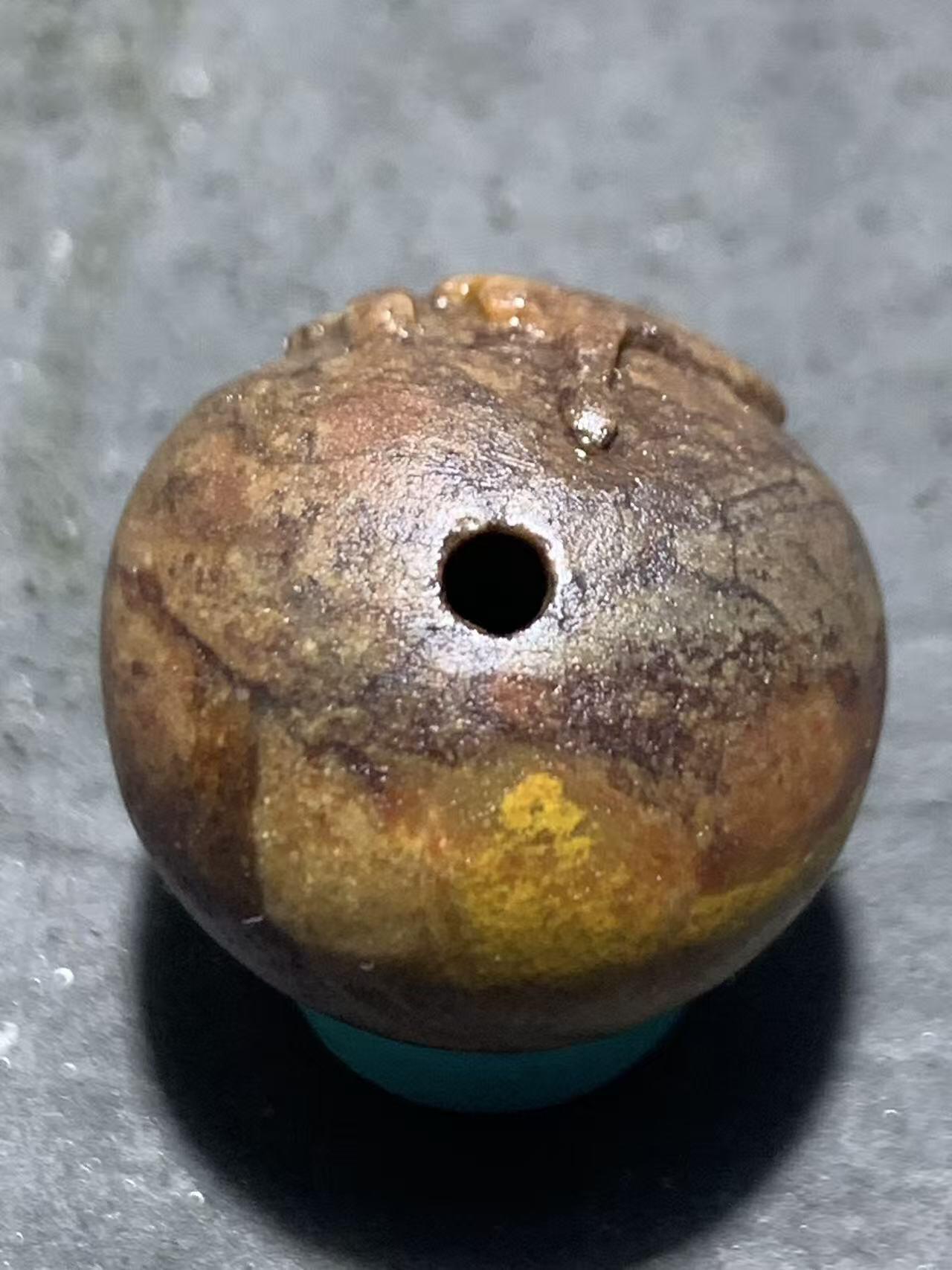 亚光战国红玛瑙手工雕刻佛字随形圆珠一颗