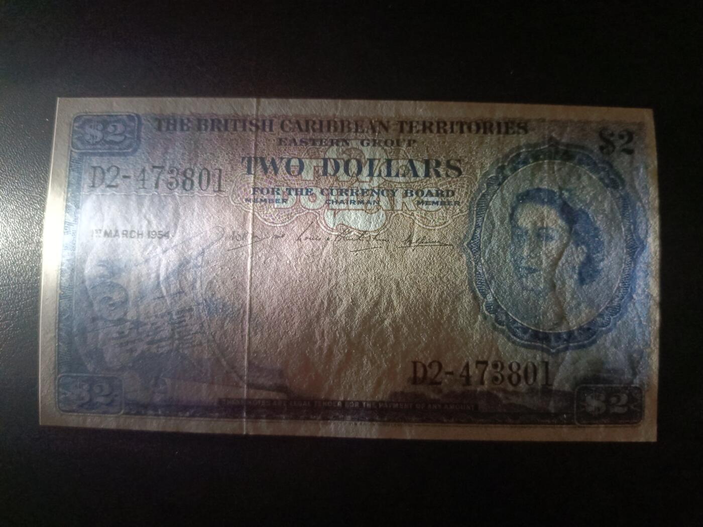 2025十二月第一期，总206期 英属加勒比领地（现东加勒比共同体）1954年2元流通好品XF，大皇冠女王和各构成殖民地徽章，稀有面值