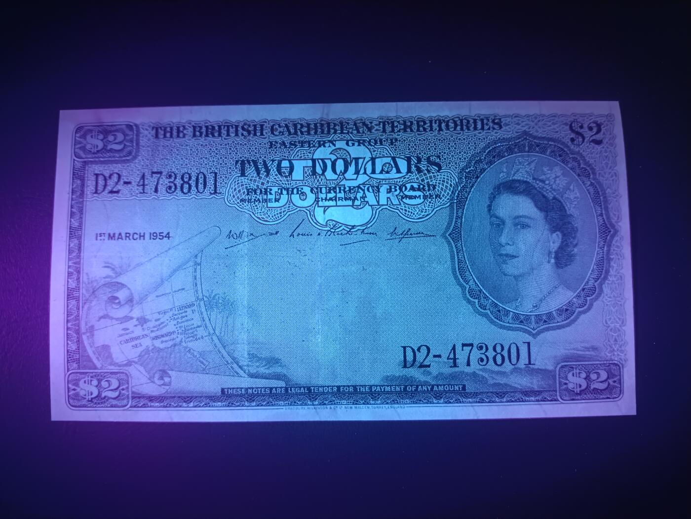 2025十二月第一期，总206期 英属加勒比领地（现东加勒比共同体）1954年2元流通好品XF，大皇冠女王和各构成殖民地徽章，稀有面值