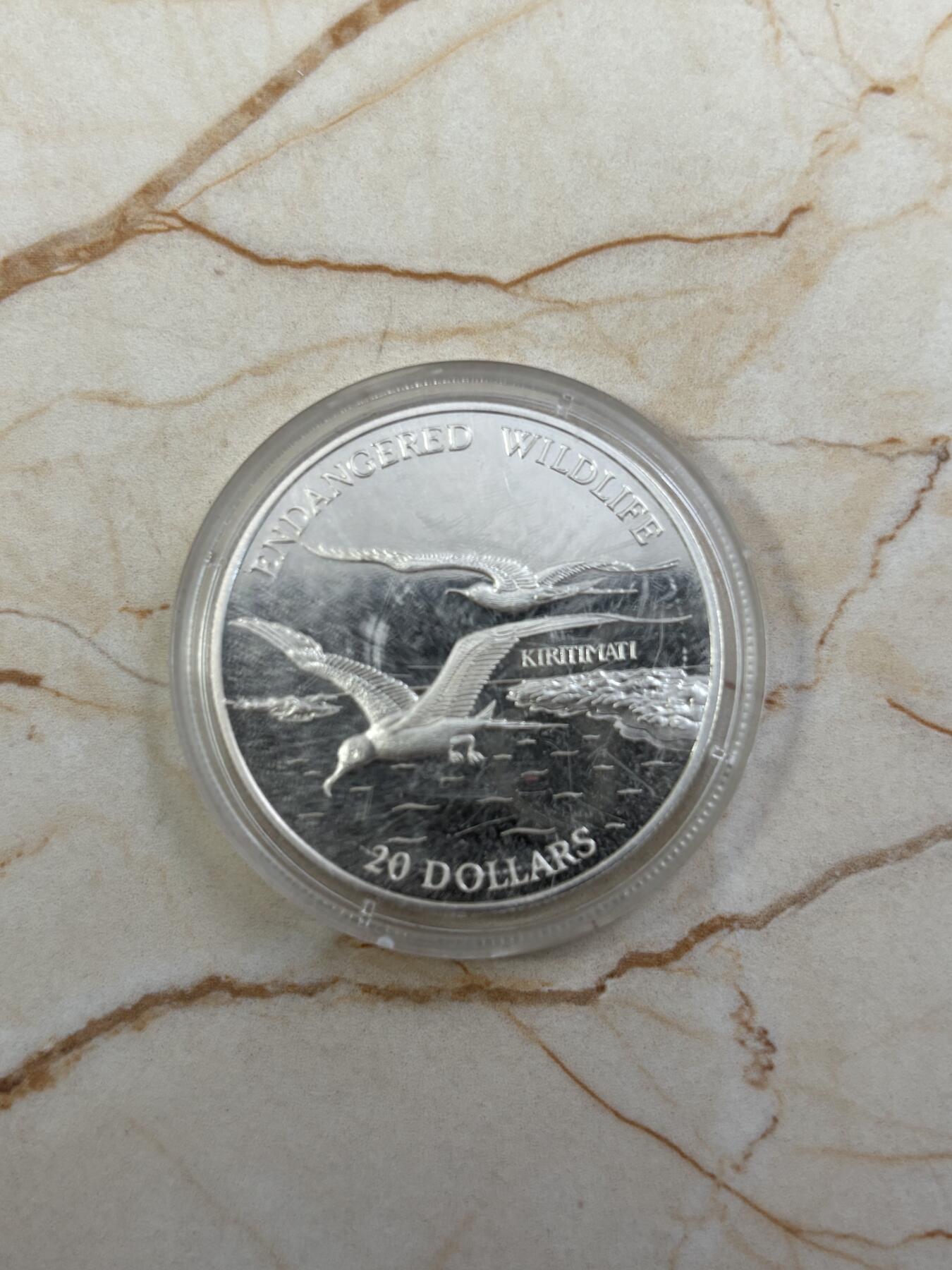 第184期拍卖 基里巴斯1992年保护濒危野生动物精制1盎司念大银币，925银银价399，