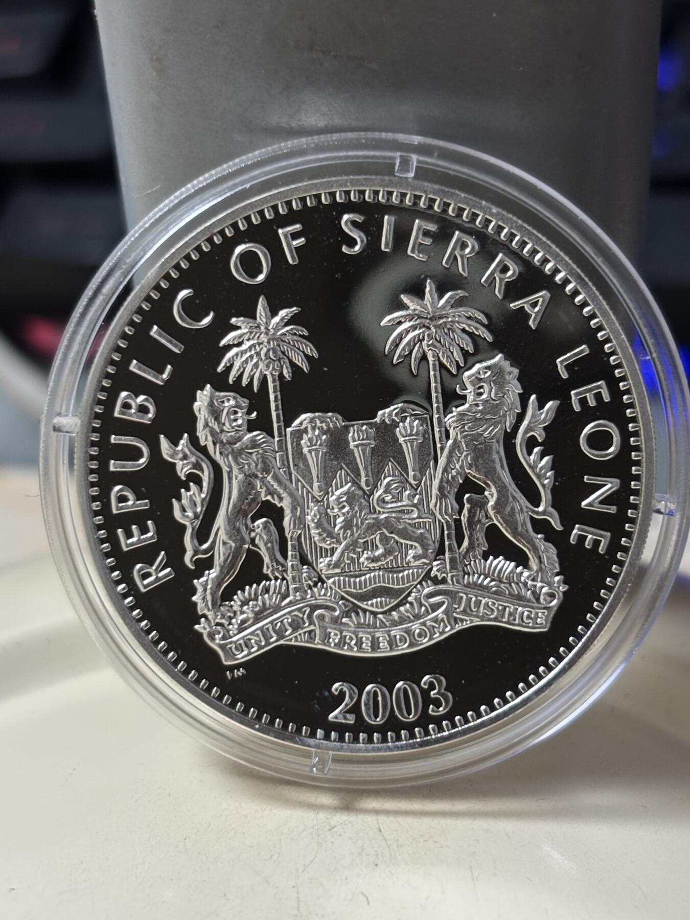第185期拍卖 塞拉利昂2003年铁臂阿童木精制彩色全套3枚银币，925银，28克*3.，有少许氧化