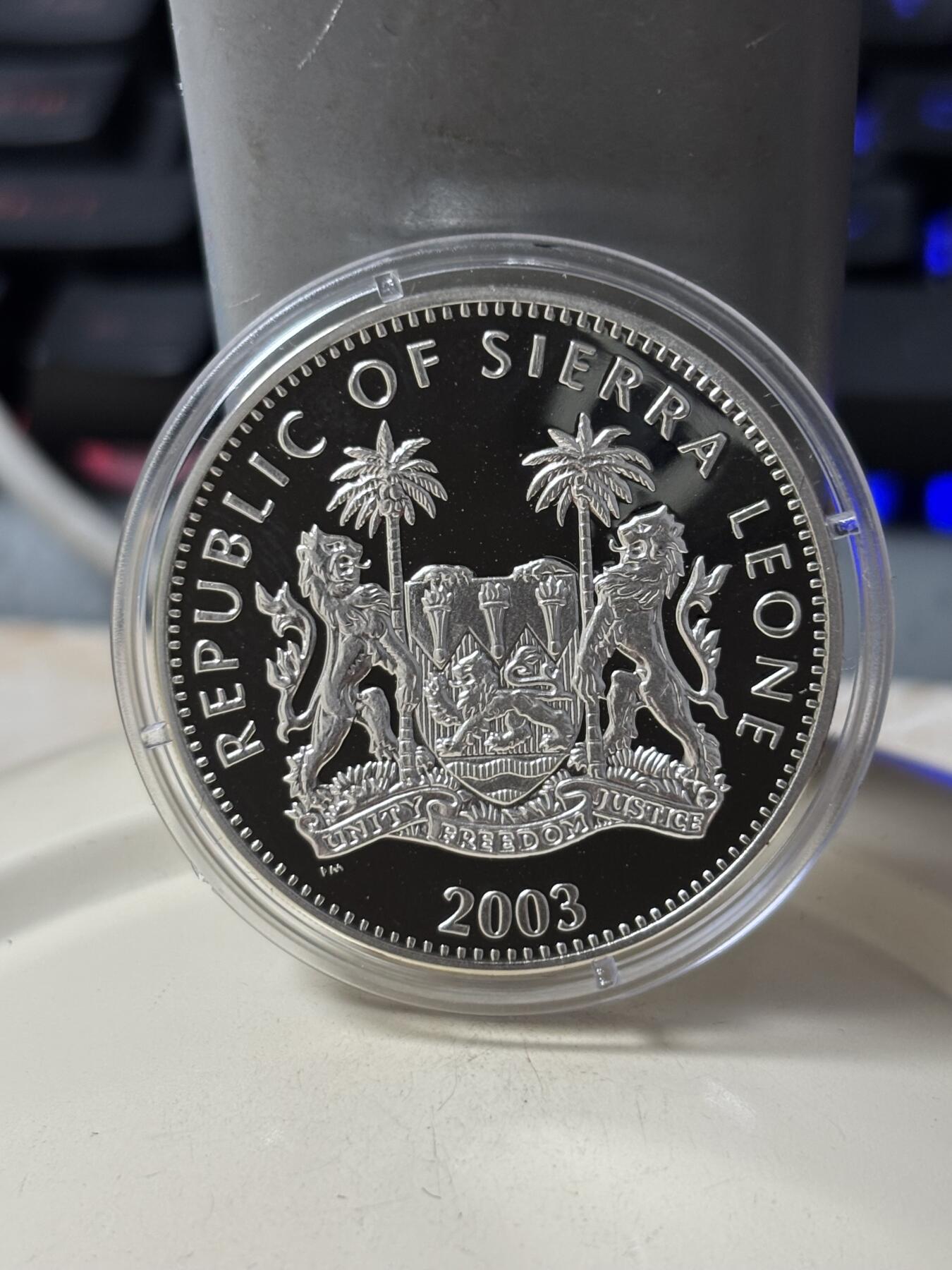 第185期拍卖 塞拉利昂2003年铁臂阿童木精制彩色全套3枚银币，925银，28克*3.，有少许氧化
