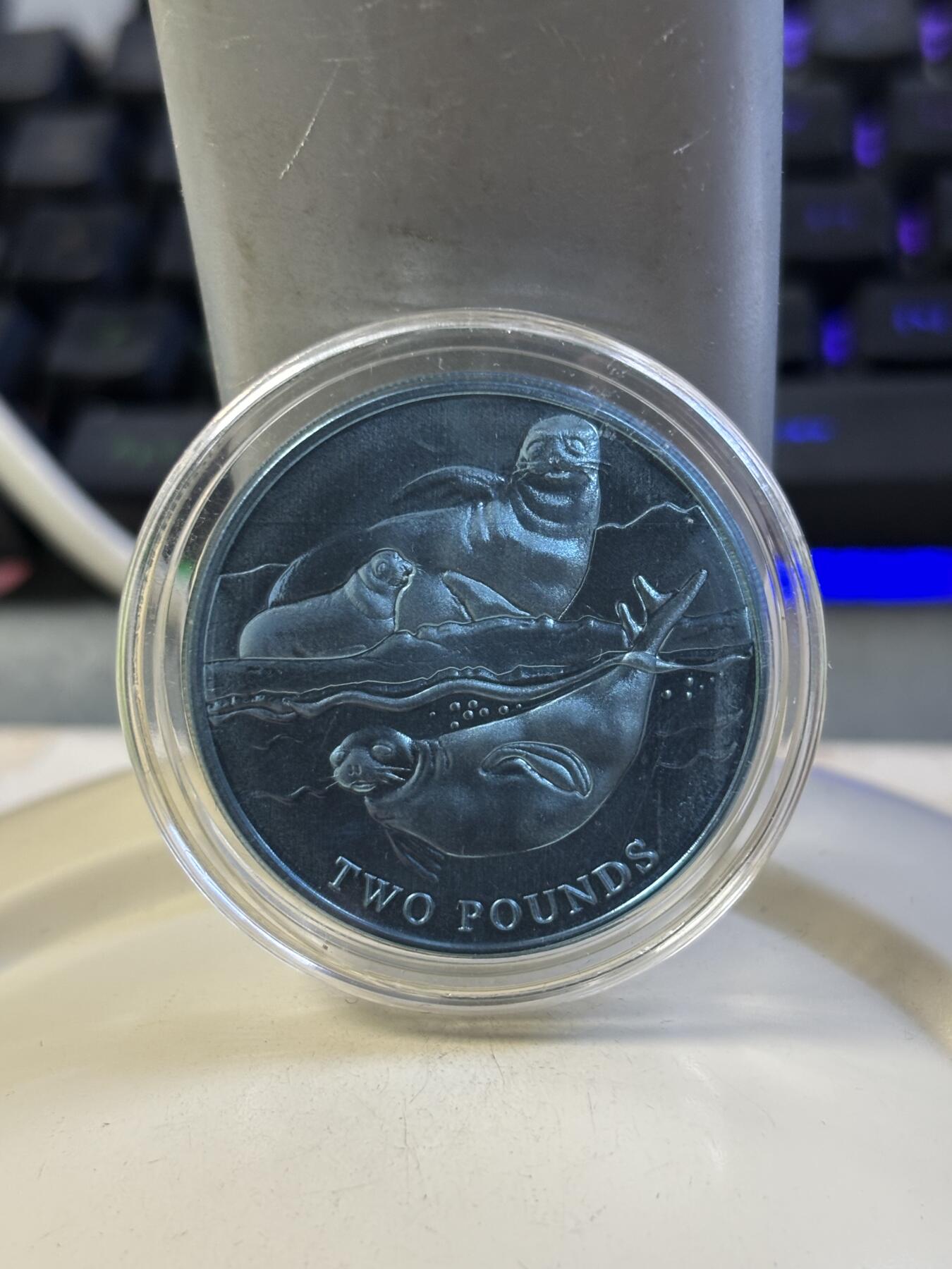 第184期拍卖 英属南极领地2017年动物系列海豹绿色纯钛纪念币