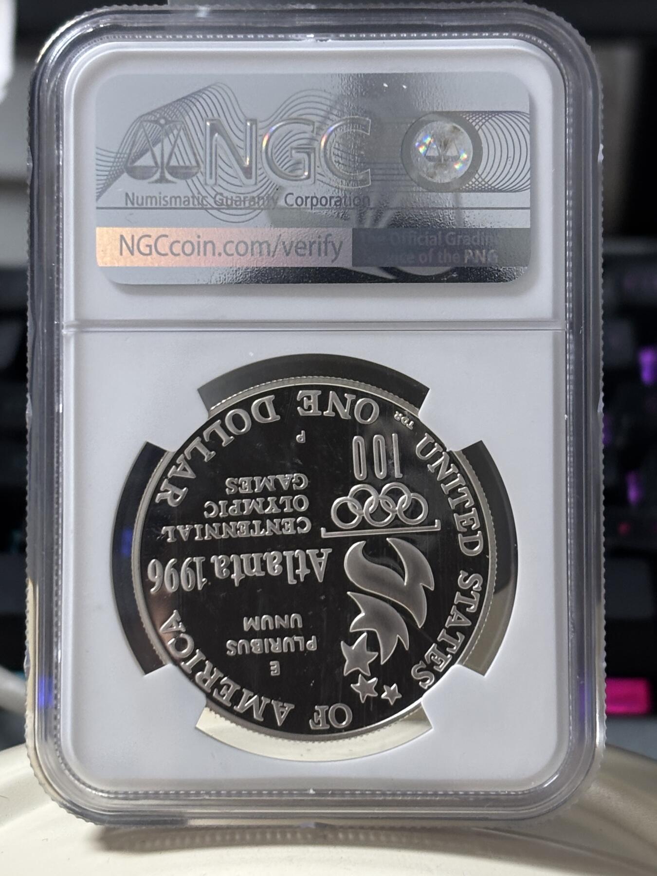 第185期拍卖 获奖美国1996年亚特兰大残奥轮椅赛银币NGC-PF69，900银，26.72克，此币荣获世界硬币大奖赛