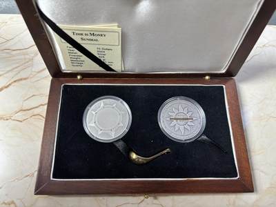 第185期拍卖 - 利比里亚刚果2004年古司南日晷计时纪念银币套装，铜镍合金/925银/925银，重量：8/25/25克，直径:27.26X14.13/38.61/38.61毫米，发行：5000套