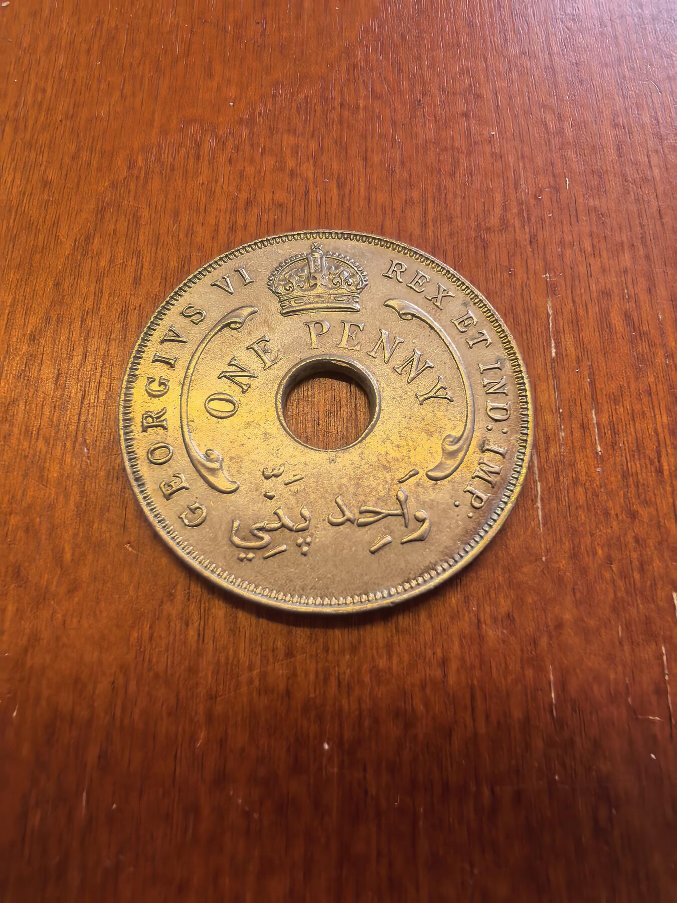 长老汇蛇年精选第八十场拍卖 1943英属西非乔治六世1便士中孔铜镍币，喜敦版，小年，克书MS60分20美金，未流通品