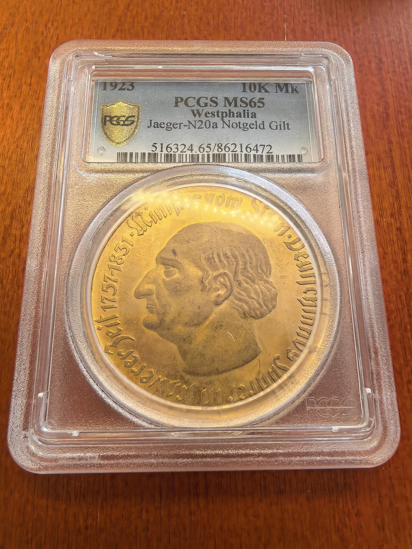 长老汇蛇年精选第八十场拍卖 1923德紧威斯特伐利亚斯坦伯爵马币1万马克镀金币，PCGS MS65，a版窄边