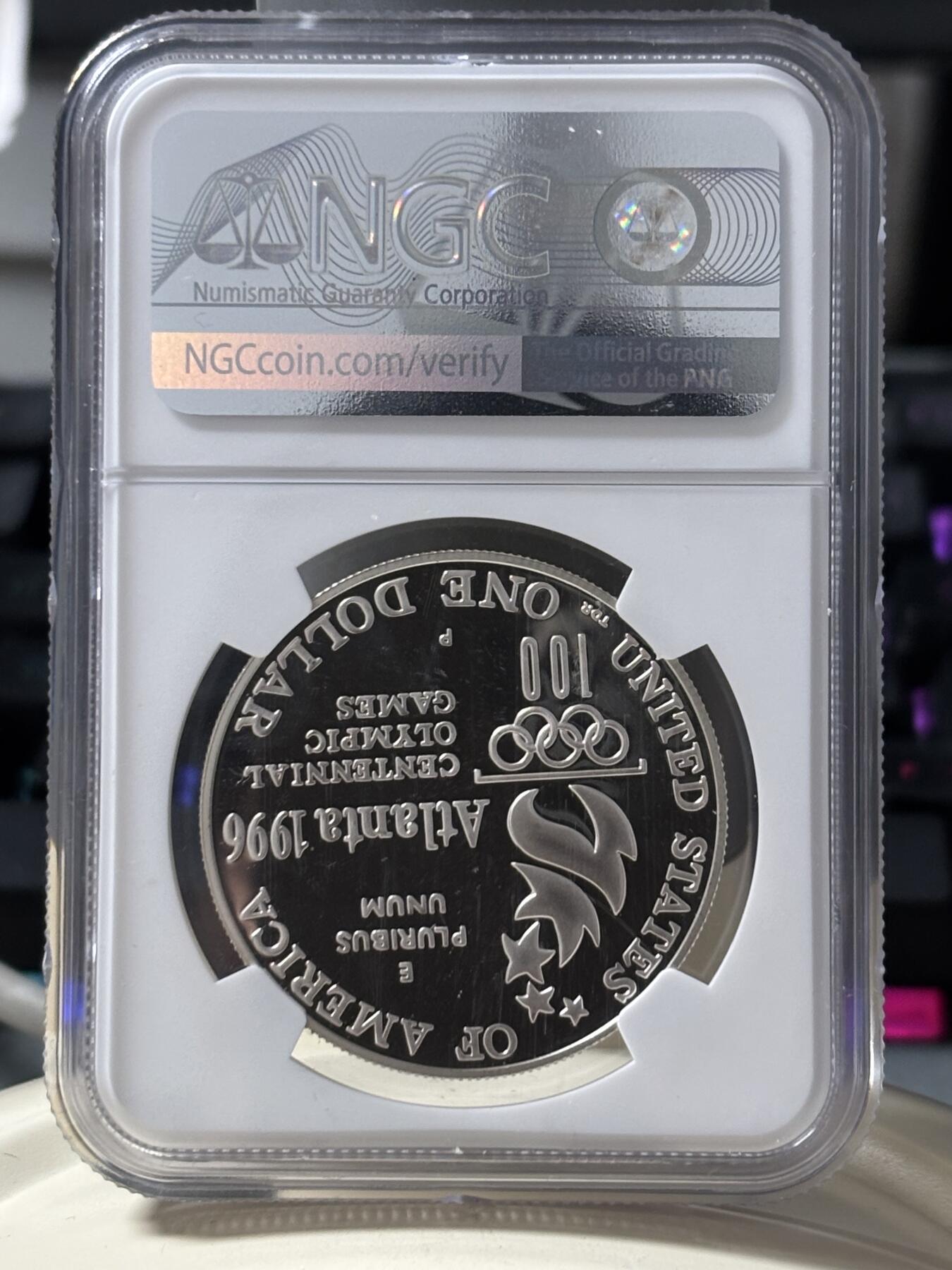 第185期拍卖 获奖美国1996年亚特兰大残奥轮椅赛银币NGC-PF69，900银，26.72克，此币荣获世界硬币大奖赛