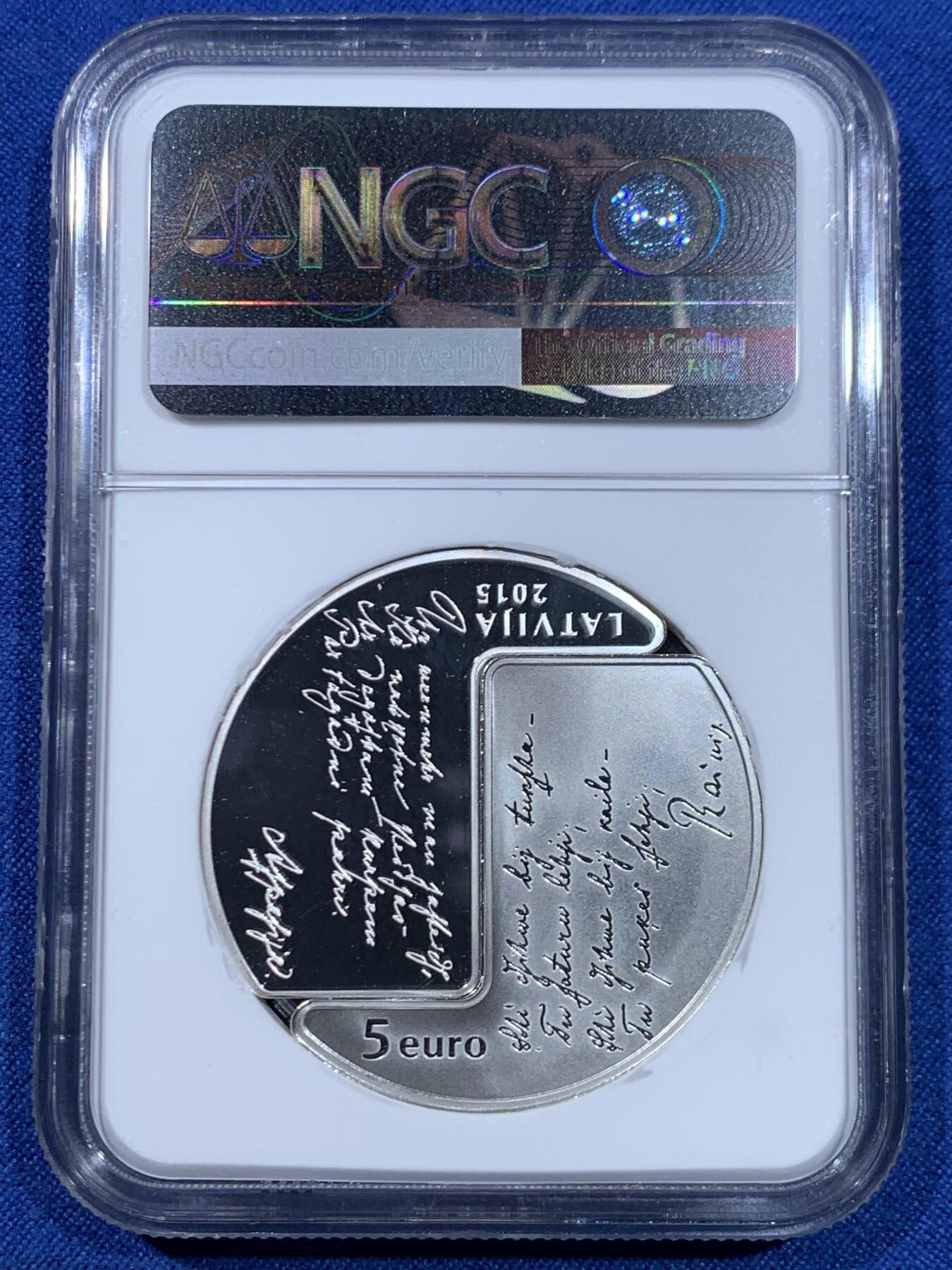 《竞宝斋》第445场 周日，周一，2场连拍 （全场包邮） 获奖币 NGC PF69UC 拉脱维亚2015年瑞尼斯和阿斯帕齐亚诞辰150周年5欧元精制纪念银币（31.47克重，925银，盒证齐全，发行量7千枚）荣膺2016年硬币之星独特概念奖第一名（银币采取了对称组合不同工艺处理手段，一半采取反向精制工艺，另一枚则采取精制工艺，正反两面均有其个人肖像及代表著作言论雕刻，属于双主题压铸手法）