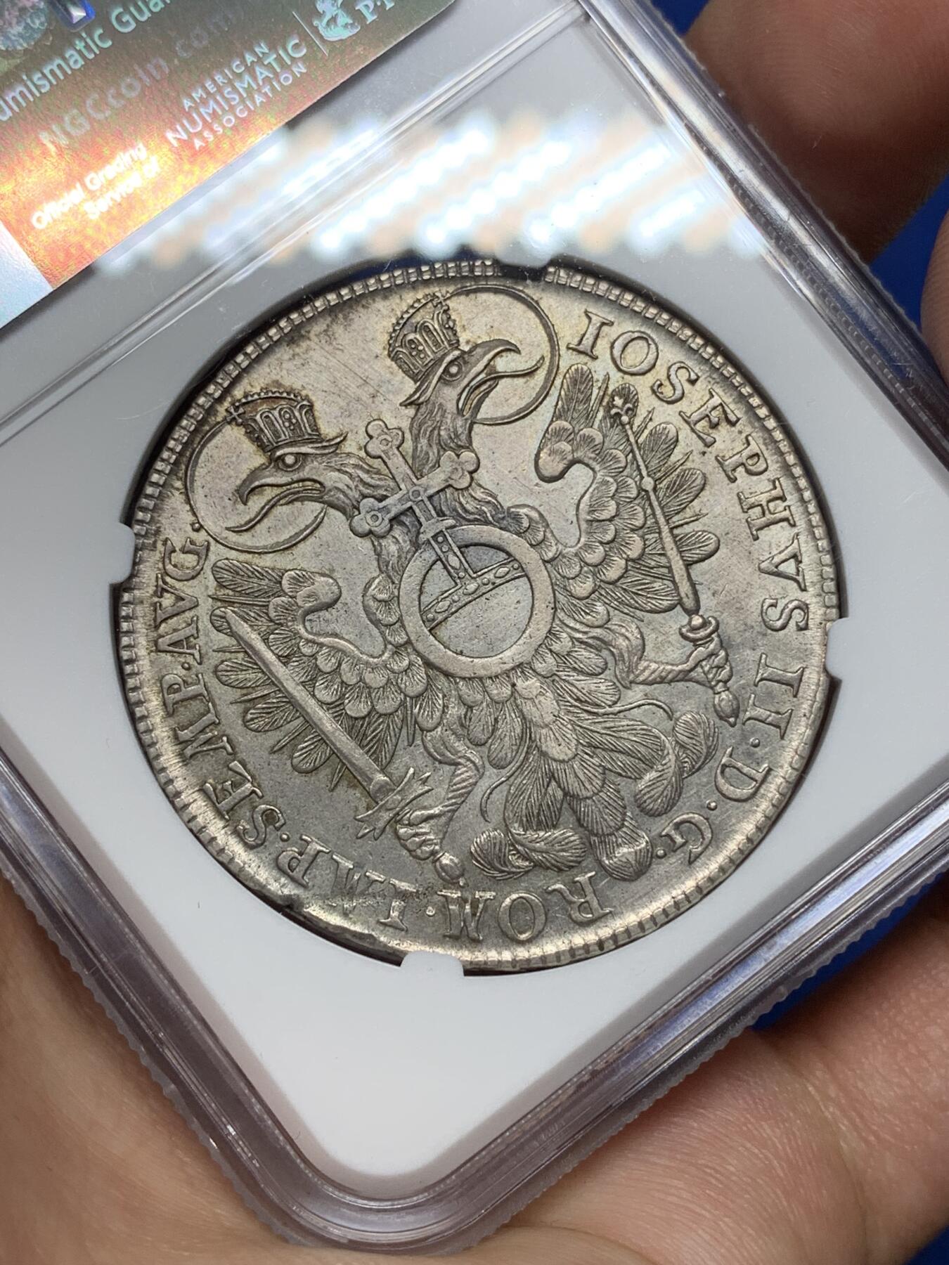 《竞宝斋》第445场 周日，周一，2场连拍 （全场包邮） NGC AUD 纽伦堡 1768年1泰勒银币 神罗纽伦堡城市景观大泰勒 错杀 该系列品种必备 城景细节较好 背面鹰徽羽毛纹理清晰 正面4点钟方向为铸缺 少见品种