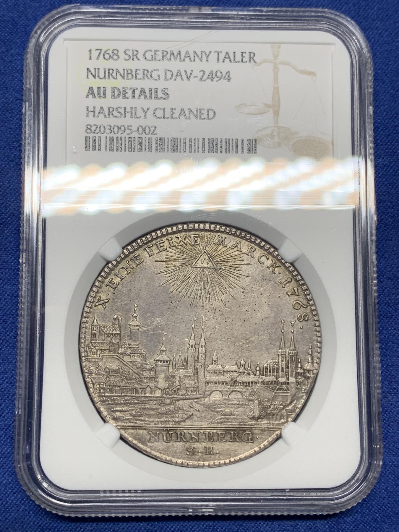 《竞宝斋》第445场 周日，周一，2场连拍 （全场包邮） NGC AUD 纽伦堡 1768年1泰勒银币 神罗纽伦堡城市景观大泰勒 错杀 该系列品种必备 城景细节较好 背面鹰徽羽毛纹理清晰 正面4点钟方向为铸缺 少见品种