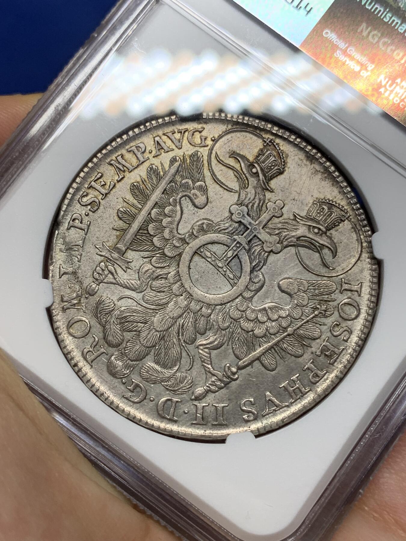 《竞宝斋》第445场 周日，周一，2场连拍 （全场包邮） NGC AUD 纽伦堡 1768年1泰勒银币 神罗纽伦堡城市景观大泰勒 错杀 该系列品种必备 城景细节较好 背面鹰徽羽毛纹理清晰 正面4点钟方向为铸缺 少见品种