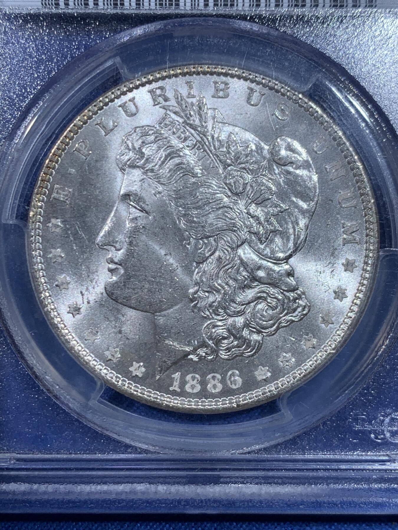 《竞宝斋》第445场 周日，周一，2场连拍 （全场包邮） PCGS MS63 美国1886年摩根一美元银币 老盒子严评，脸颊干净，状态不错。