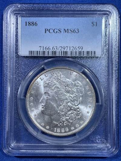 《竞宝斋》第445场 周日，周一，2场连拍 （全场包邮） - PCGS MS63 美国1886年摩根一美元银币 老盒子严评，脸颊干净，状态不错。