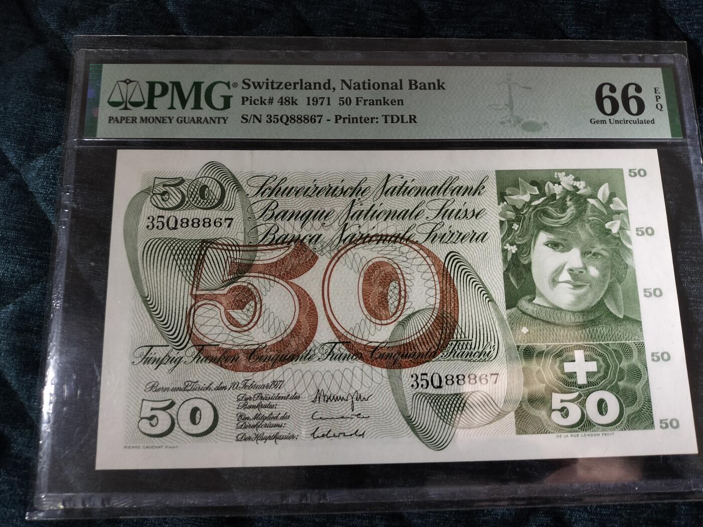【礼羽收藏】🌏世界钱币拍卖第115期 瑞士1971年50法郎纸币，PMG66 EPQ评级，全新未流通，票面保存完美，编号35Q88867。瑞士国家银行发行，苹果园图案，收藏价值高，适合钱币收藏爱好者。