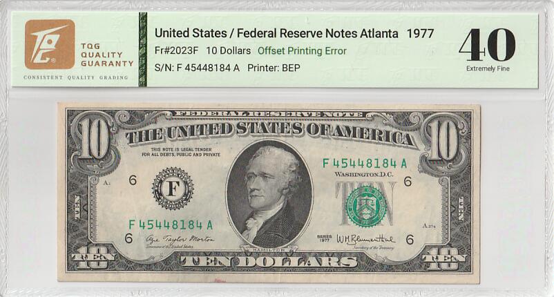 2025十二月第二期，总207期 美国1977年10元TQG40分，由于背面油墨折叠失误造成了一种有趣的“背面错滚墨”错版