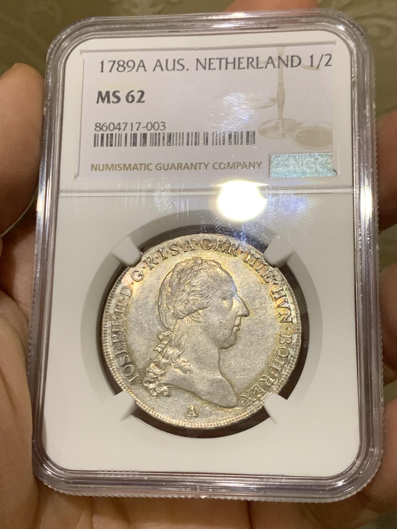 《竞宝斋》第446场 周日，周一，2场连拍 （全场包邮） 唯一冠军分 NGC MS62 奥属尼德兰 1789年 约瑟夫二世 1/2泰勒银币 全深打在这个品类上已经很难得了 包浆也好