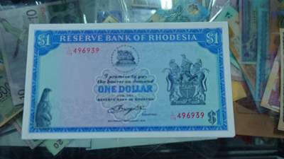 世界钱币～微拍第219期暨2025年第59期  老库存低价起拍 - 1979年罗德西亚1元 全新绝品尾号939（之前一刀里选了10多张送评全部66-68分，出过几张冠军分）成本价起拍