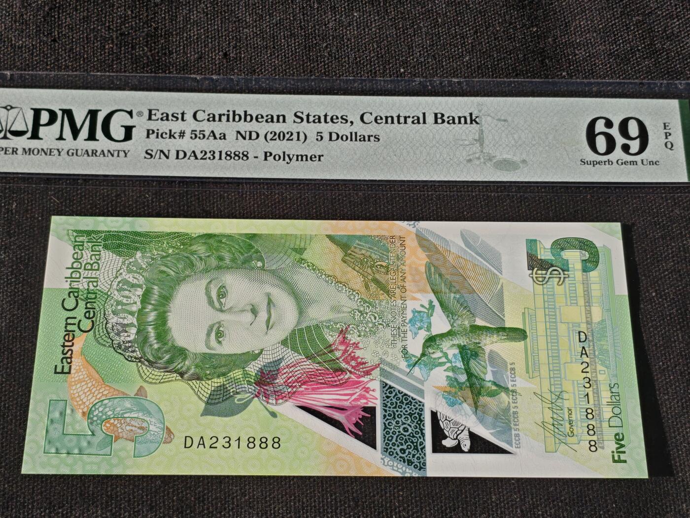 刘世昌艺术品销售中心～虎踞龙蟠*金杨在线联拍群第511期 东加勒比2021年5元【豹子号】（PMG  69E  号码：DA231888）1枚。