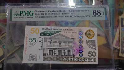 世界钱币～微拍第219期暨2025年第59期  老库存低价起拍 - 2012年苏里南50元纪念钞 无47 PMG68E高分