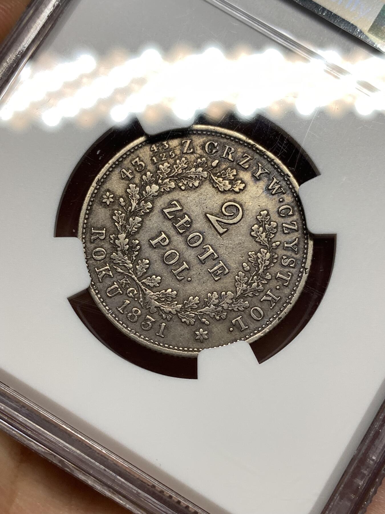 《竞宝斋》第446场 周日，周一，2场连拍 （全场包邮） NGC XFD 波兰革命政府 1831年 2兹罗提 银币 波兰在1830年起义（十一月起义）后曾短暂建立民族政府 直到1831年9月被沙俄镇压 该时期发行的钱币极为少见 克书参考价375美金（XF-40） 稀缺品种