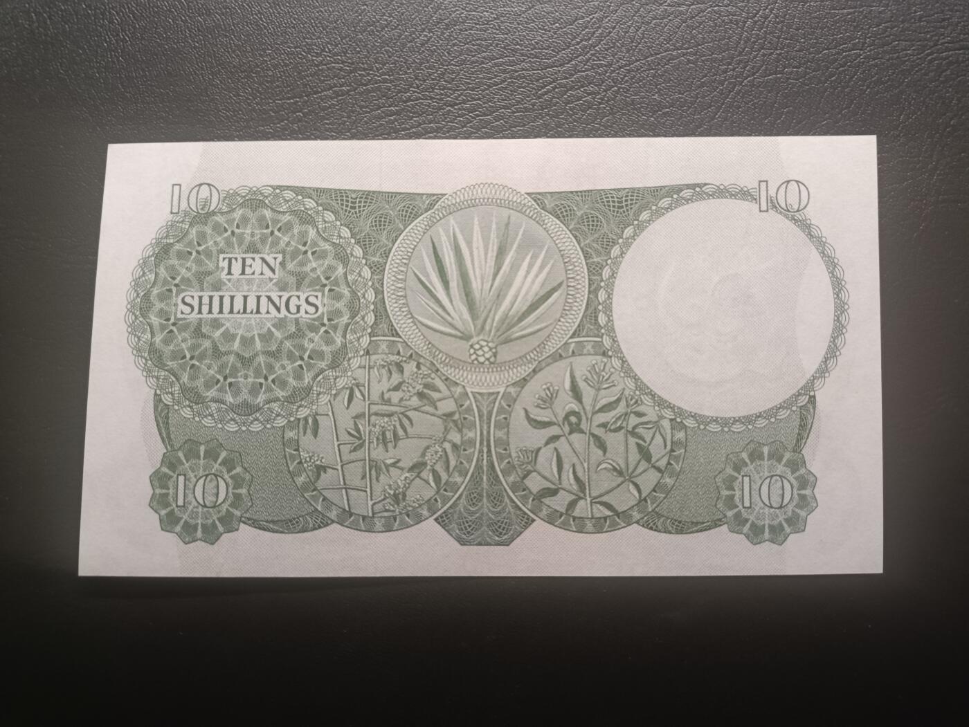 2025十二月第二期，总207期 英属东非1964版10先令UNC-背面微微蓝墨迹，首冠A1，帆船和植物，稀有英属殖民地品种，殖民时期最后一版