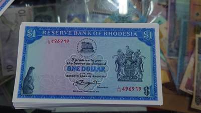 世界钱币～微拍第219期暨2025年第59期  老库存低价起拍 - 1979年罗德西亚1元 全新绝品尾号919（之前一刀里选了10多张送评全部66-68分，出过几张冠军分）成本价起拍