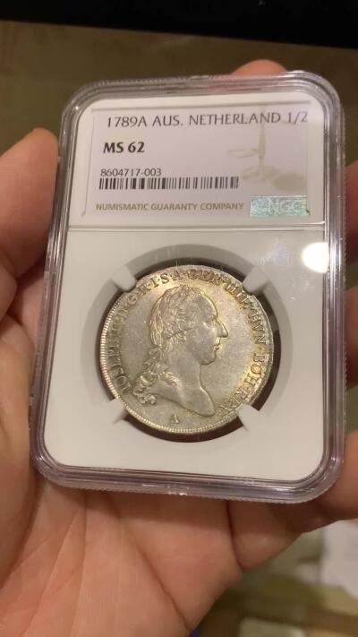 《竞宝斋》第446场 周日，周一，2场连拍 （全场包邮） 唯一冠军分 NGC MS62 奥属尼德兰 1789年 约瑟夫二世 1/2泰勒银币 全深打在这个品类上已经很难得了 包浆也好