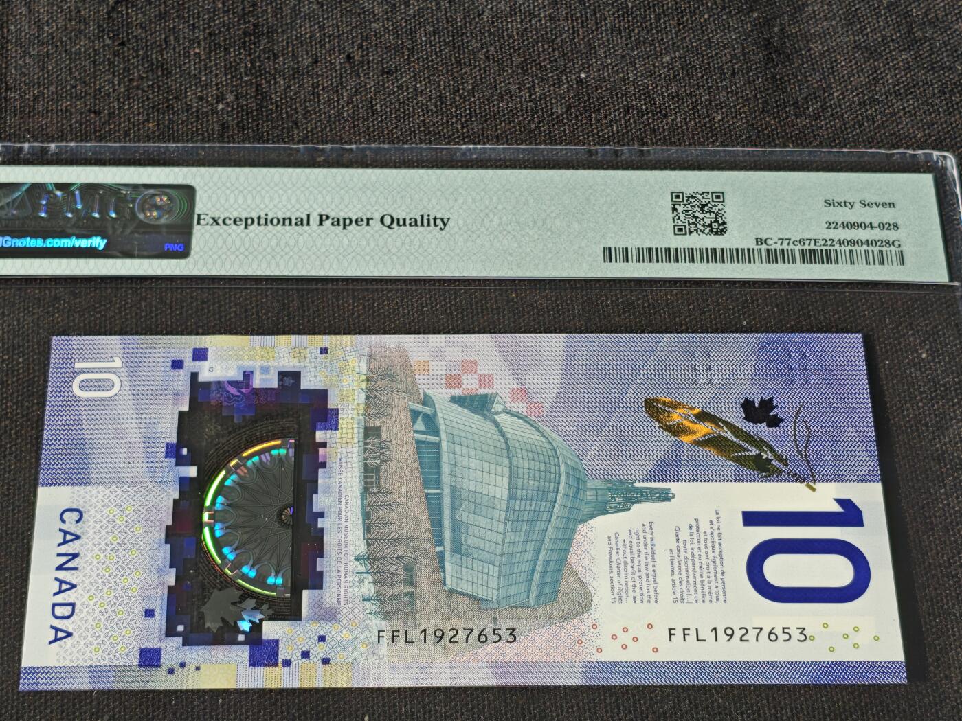 刘世昌艺术品销售中心～虎踞龙蟠*金杨在线联拍群第511期  加拿大2018年10元（PMG 67E 号码：FFL 1927653）1枚。此钞荣获当年IBNS世界纸币大奖赛“最佳纸币”大奖。