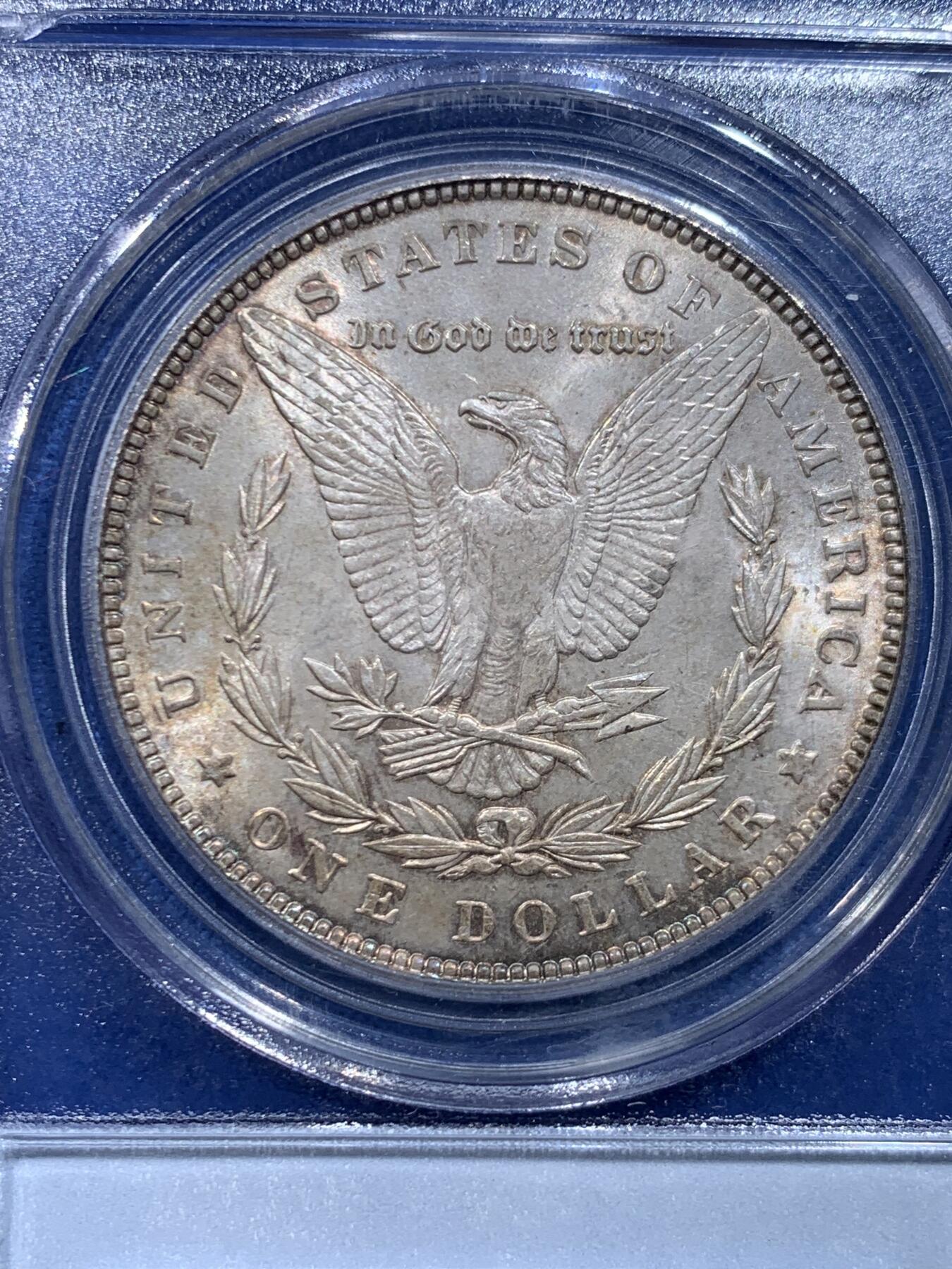 《竞宝斋》第446场 周日，周一，2场连拍 （全场包邮） PCGS MS63 美国1889年摩根银币，老白盒严评，状态很好，带点环彩。背面支撑四角有磕