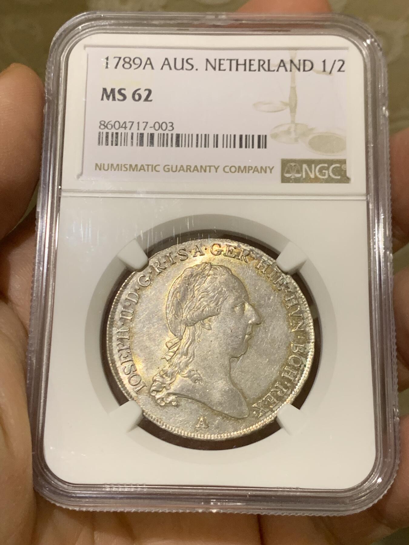 《竞宝斋》第446场 周日，周一，2场连拍 （全场包邮） 唯一冠军分 NGC MS62 奥属尼德兰 1789年 约瑟夫二世 1/2泰勒银币 全深打在这个品类上已经很难得了 包浆也好