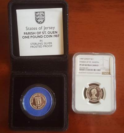 ❤️【币观天下】❤️ 第334期钱币拍卖- 2025.12.12周五晚上6点半场-长期征集拍品 - 泽西1987年教区一镑精制套币一对 发行量2500枚，圣欧文和圣马丁，原盒证一枚，NGC69一枚